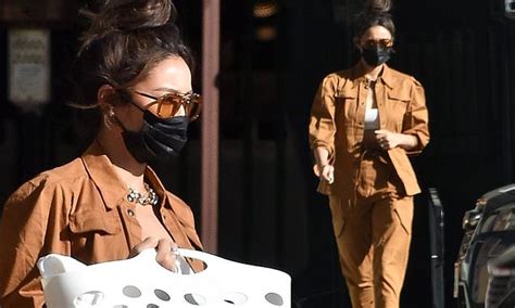Shay Mitchell Teases Her Taut Tummy In Chic Caramel Ensemble As She