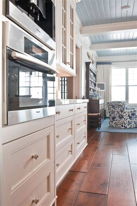 Microwave ovens apply the property of heating of microwave radiations to cook food. Miele microwave & coffee maker, white cabinetry, barnboard ...