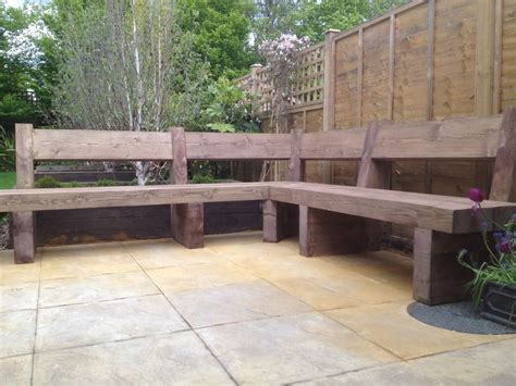 The entire bench is designed from tree limbs that have been cut to size. Sleeper bench corner seating in garden, N8 | Pergola ...