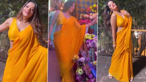 hot bhojpuri actress monalisa dancing to the tunes of tip tip barsa pani in a sexy yellow