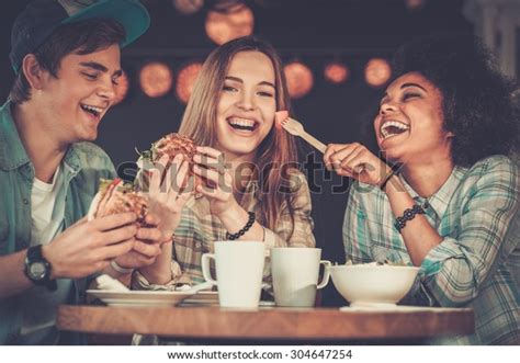 Cheerful Multiracial Friends Eating Cafe Stock Photo Edit Now 304647254