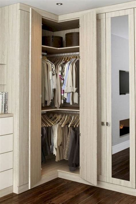 An Open Closet With Clothes Hanging In It
