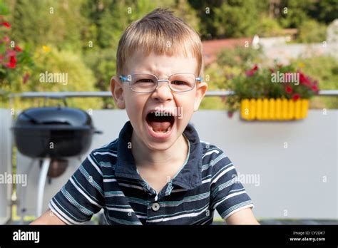 Crying Boy On Terrace Stock Photo Alamy