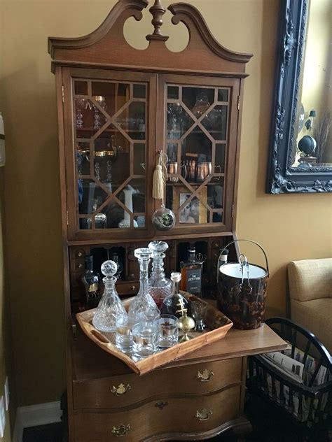 This upholstered stool showcases multiple hue options and nailhead trim for a classic touch of accent. Antique Secretary desk... Used it as a living room BAR ...