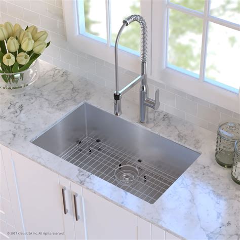 An undermount sink is mounted beneath the counter. Kraus KHU10030 30 Inch Undermount Single Bowl Kitchen Sink ...