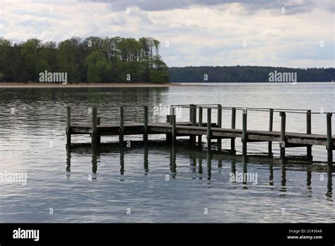 Old Rusty Dock By The Lake Surrounded By Beautiful Trees In Middelfart