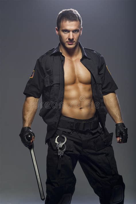 Good Looking Policeman Bodybuilder Posing Stock Image