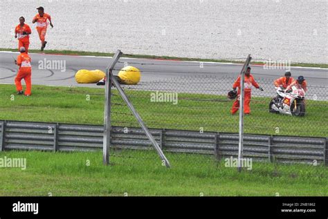 Italys Rider Marco Simoncelli Lies On The Racetrack After A Crash