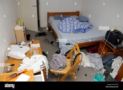 Untidy Cluttered Bedroom In Disarray Messy Bed Boys Room Stock Photo