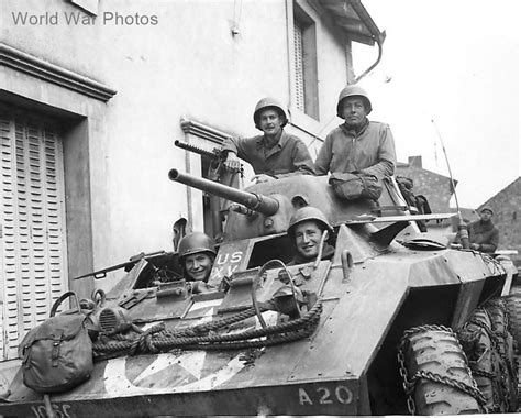 Us Soldiers In M8 Of The 106th Cavalry Regiment In Small French Village