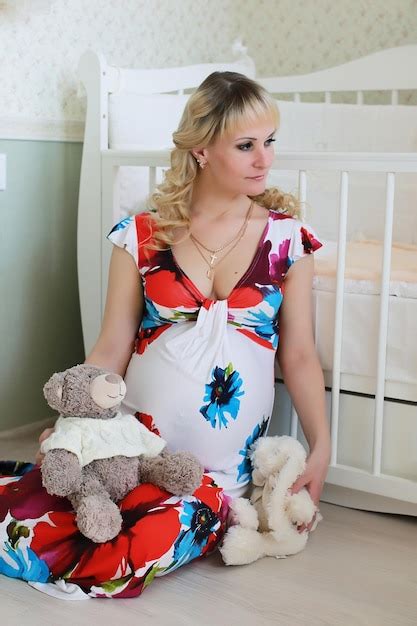 Premium Photo Beautiful Girl Pregnant Blonde Prepares To Become A Mom