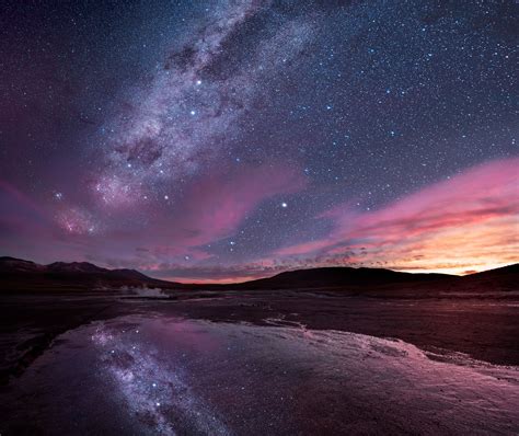 A Milky Way Sunset Reflecting In The El Taito Geyser Field Located