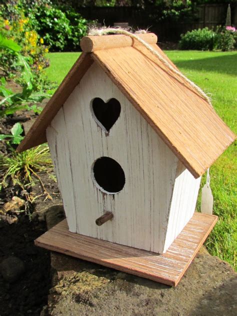 If you love crafting but aren't into woodworking projects, there are plenty of creative ways to make a birdhouse more custom. Wood Bird House - Aztec Stone and Reclamations
