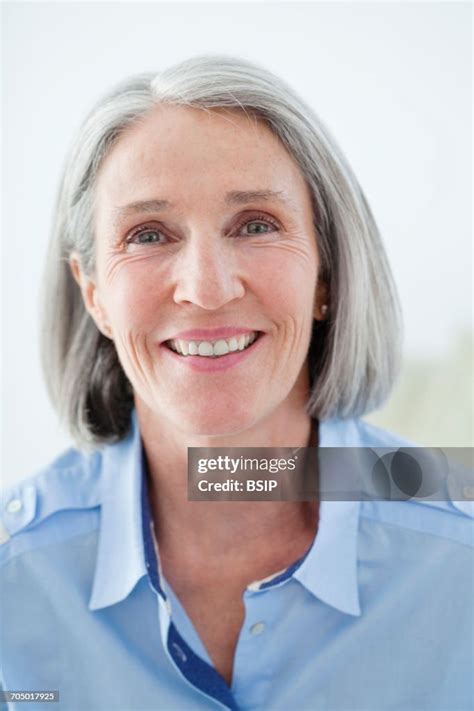 Portrait Of 65 Yrold Woman High Res Stock Photo Getty Images