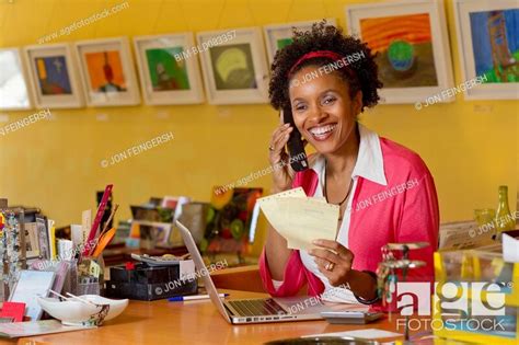 African American Small Business Owner Working In Shop Stock Photo