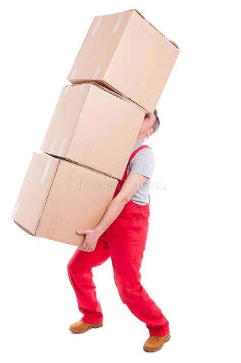 Guy Lifting Or Holding Bunch Of Heavy Cardboard Boxes Stock Photo