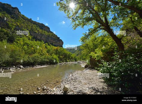 river flowing through canyon with sun in the summer gorges de l eygues saint may remuzat