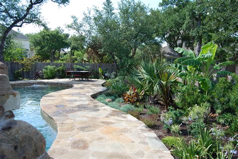 For super simple pool landscaping, stick with shrubs and grasses. tropical landscape design for an Austin, Tx swimming pool ...
