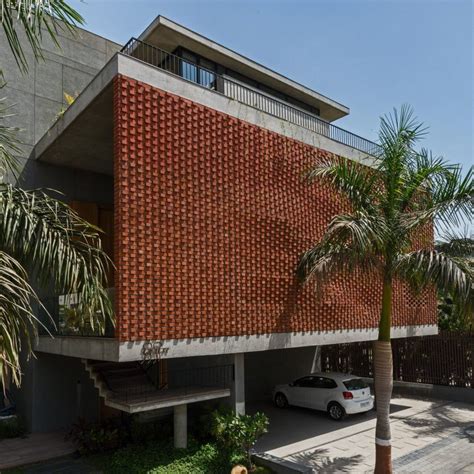 Rippling Red Brick Facade Shades House In Surat By Design Work Group