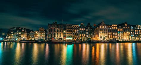 Amsterdam City Panorama Illuminated Buildings Or Dancing Houses With