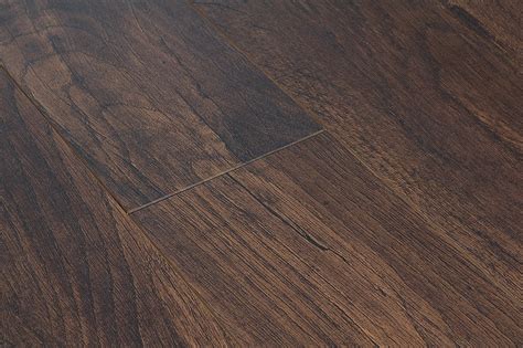 Dark laminate flooring is a relatively new trend that doesn't appear to be on its way out of style any time soon. Toklo Laminate - 12mm Acacia Collection Dark Walnut