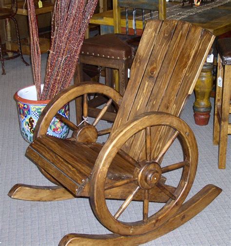 Rock me, mama, like one of these gorgeous wagon wheel decor ideas. #4500 WAGON WHEEL ROCKING CHAIR 269 1.JPG | Rustic outdoor ...