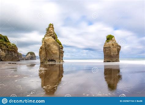 Rock Formations On The Beach Known As Three Sisters And The Mount