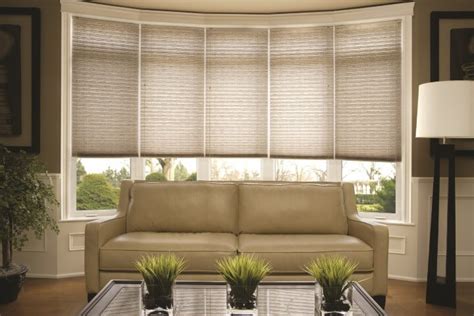 Wood blinds add a warm, inviting feel to bay windows. Top 5 Window Treatments for Bay Windows