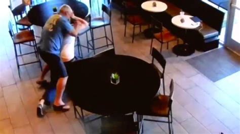cctv captures coffee shop customer fighting off knife wielding robber