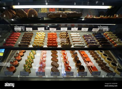 Assorted Flavor Colorful Eclair And French Pastry Bakery Displayed In