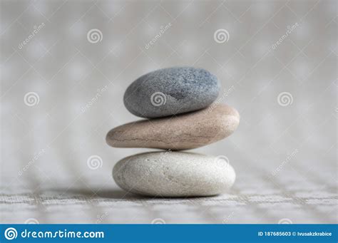 Stone Cairn On Striped Grey White Background Three Stones Tower Simple Poise Stones