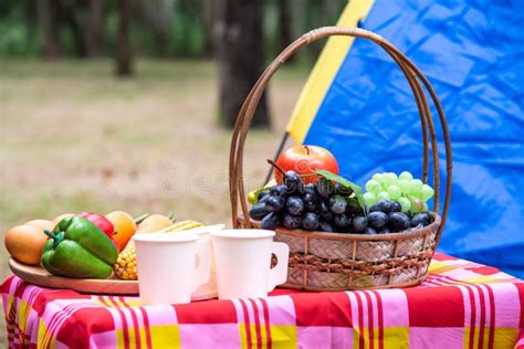 Fruit Basket Picnic Basketry With Food On The Table And Tent For