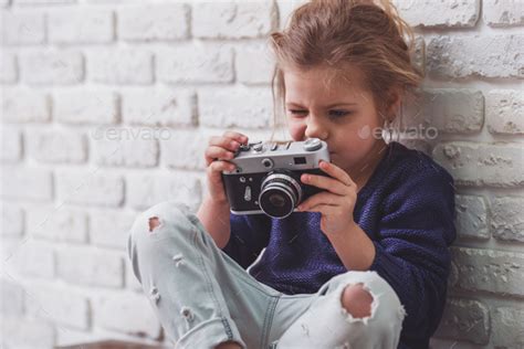 Little Girl With Camera Stock Photo By Georgerudy Photodune