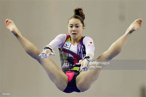 Natsumi Sasada Of Japan Performs On The Uneven Bars During The Photo