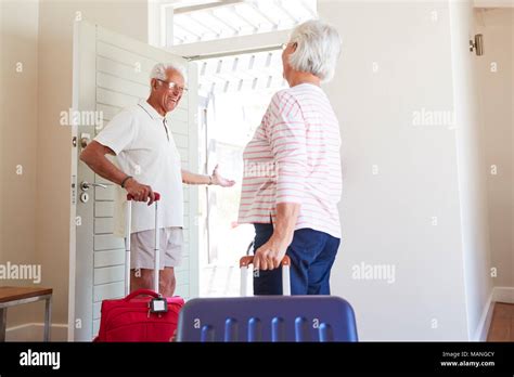 Senior Couple Leaving Summer Vacation Rental Stock Photo Alamy