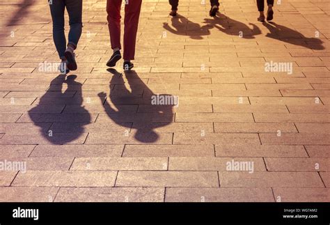 Shadows People Walking On Pavement Hi Res Stock Photography And Images