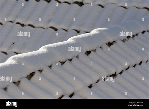 Snow Covered Roof Tiles Stock Photo Alamy