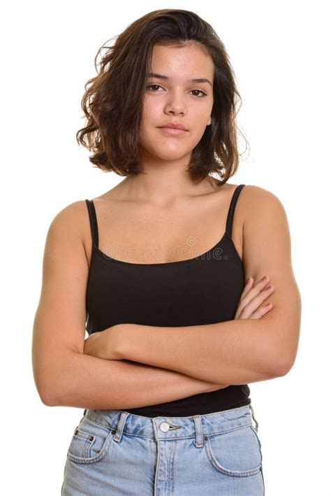 Portrait Of Young Beautiful Caucasian Teenage Girl With Arms Crossed