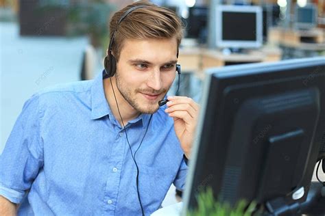 Cheerful And Amiable Young Man In Call Center With A Pleasant Smile