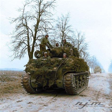 A Sherman Tank Covered In Camouflage Of The French 2nd Armored Division