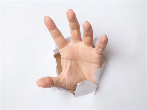 Premium Photo Male Hand Punching Through The Paper