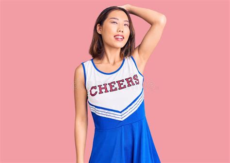 Young Beautiful Chinese Girl Wearing Cheerleader Uniform Smiling