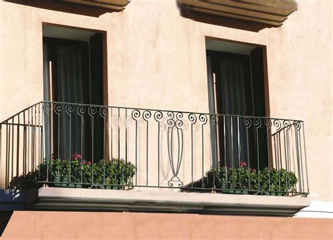 An Elegant Balcony Railing With Our Wrought Iron Balusters And Railing