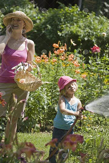 Mother And Daughter Gardening Together Stock Image Image Of Happy Conversation 5888871