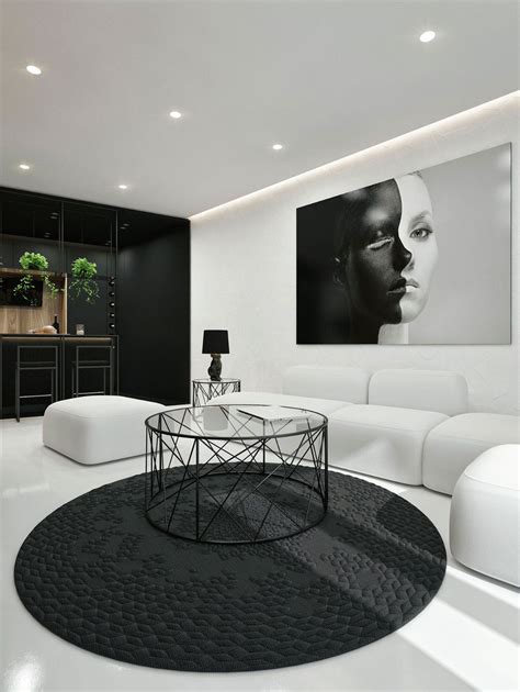 A Modern Living Room With White Furniture And Black Accents On The