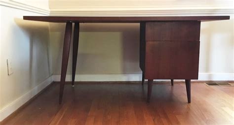 This wide desk features two drawers built into its front with carved, arched notch handles. Mid Century Modern Writing Desk with Two Drawers, Splayed ...