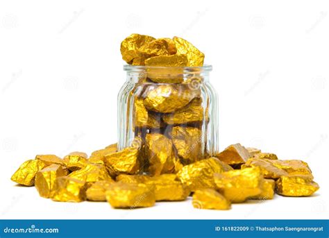 Gold Nuggets Or Gold Ore And Glass Jar Isolated On White Background
