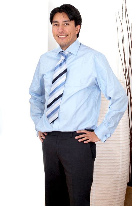 Confident Hispanic Business Man Portrait In An Office Freestock Photos
