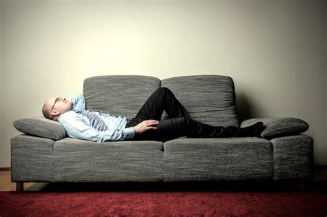 Premium Photo Businessman Lying On A Sofa