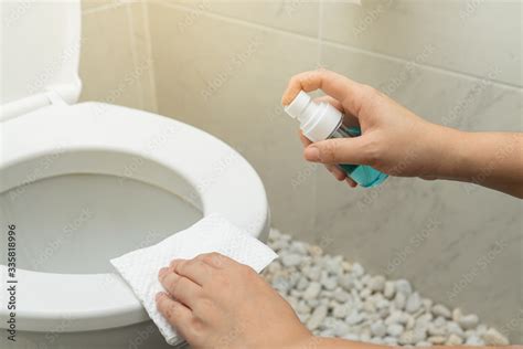 Disinfect Sanitize Hygiene Care People Using Alcohol Spray On Toilet